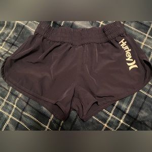 Women’s navy Hurley swim shirts. Size medium.